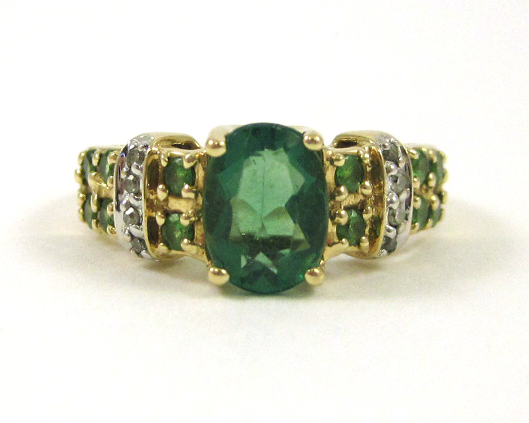 Appraisal: EMERALD DIAMOND AND FOURTEEN KARAT GOLD RING featuring an oval-cut