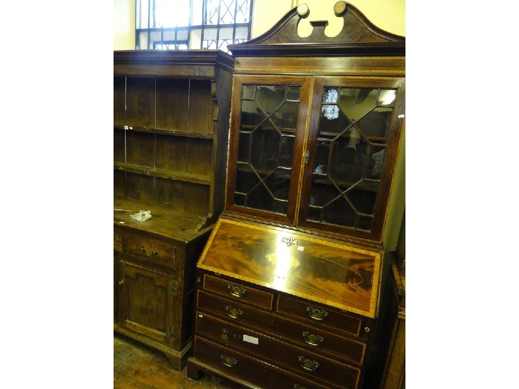 Appraisal: A Georgian style mahogany bureau bookcase with decorative satinwood banded