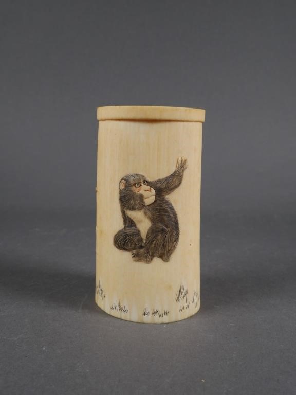 Appraisal: Carved ivory brush pot cup shaped with monkey and elephant