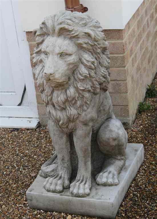 Appraisal: A pair of composition garden statues modelled as seated lions