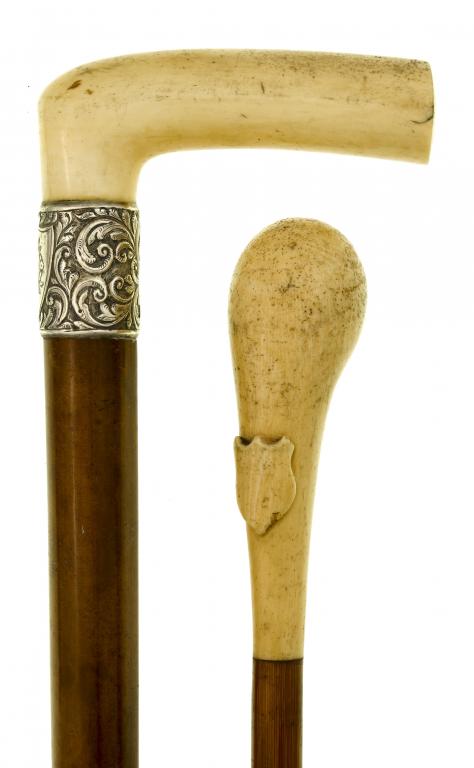 Appraisal: TWO VICTORIAN IVORY HANDLED CANES one with bulbous handle carved