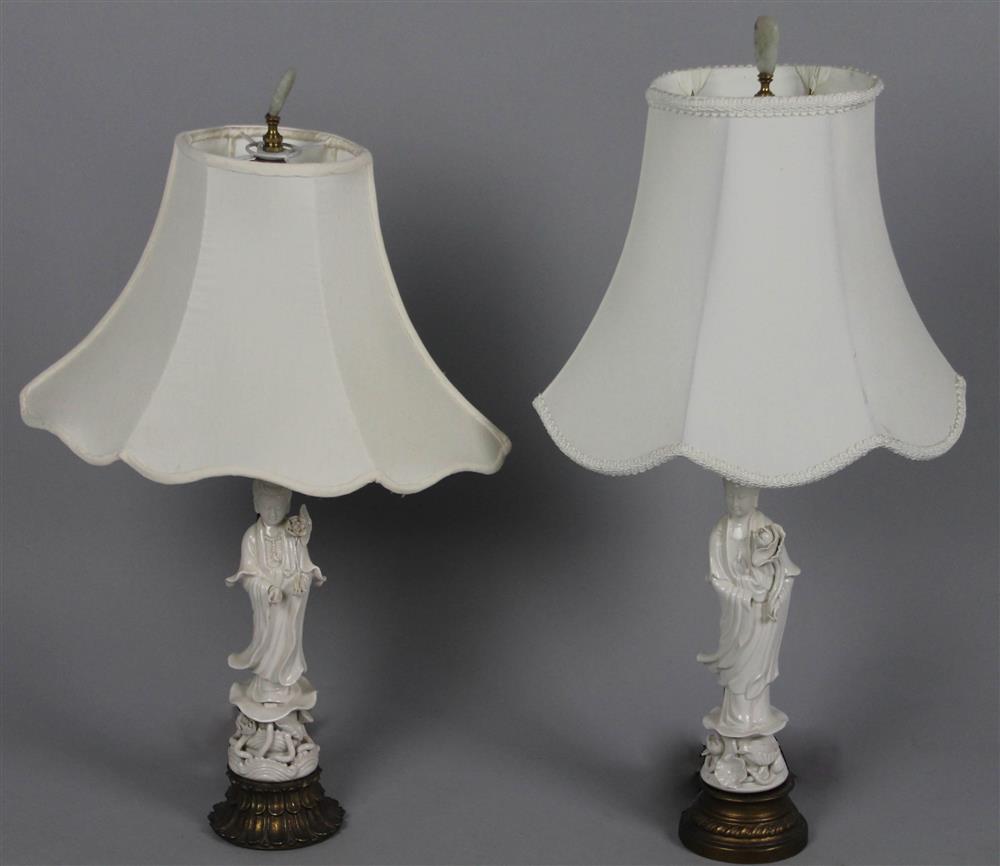 Appraisal: TWO CHINESE BLANC-DE-CHINE SMALL GUANYIN-MOUNTED LAMPS both figures modeled in