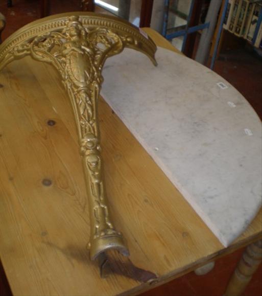 Appraisal: A demi-lune marble top console table on cast iron base