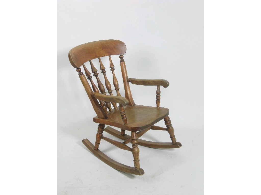 Appraisal: A Child's beech and ash Rocking Chair with spindle back