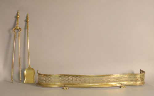 Appraisal: Brass serpentine fire fender together with a pair of steeple