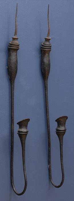 Appraisal: RICHARD SEXTONE PAIR OF WALL APPLIQUES Forged iron the back