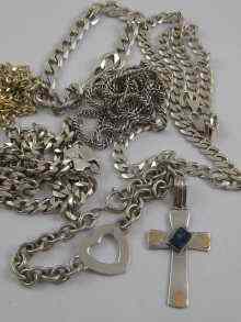 Appraisal: A mixed lot comprising three flat link neck chains each