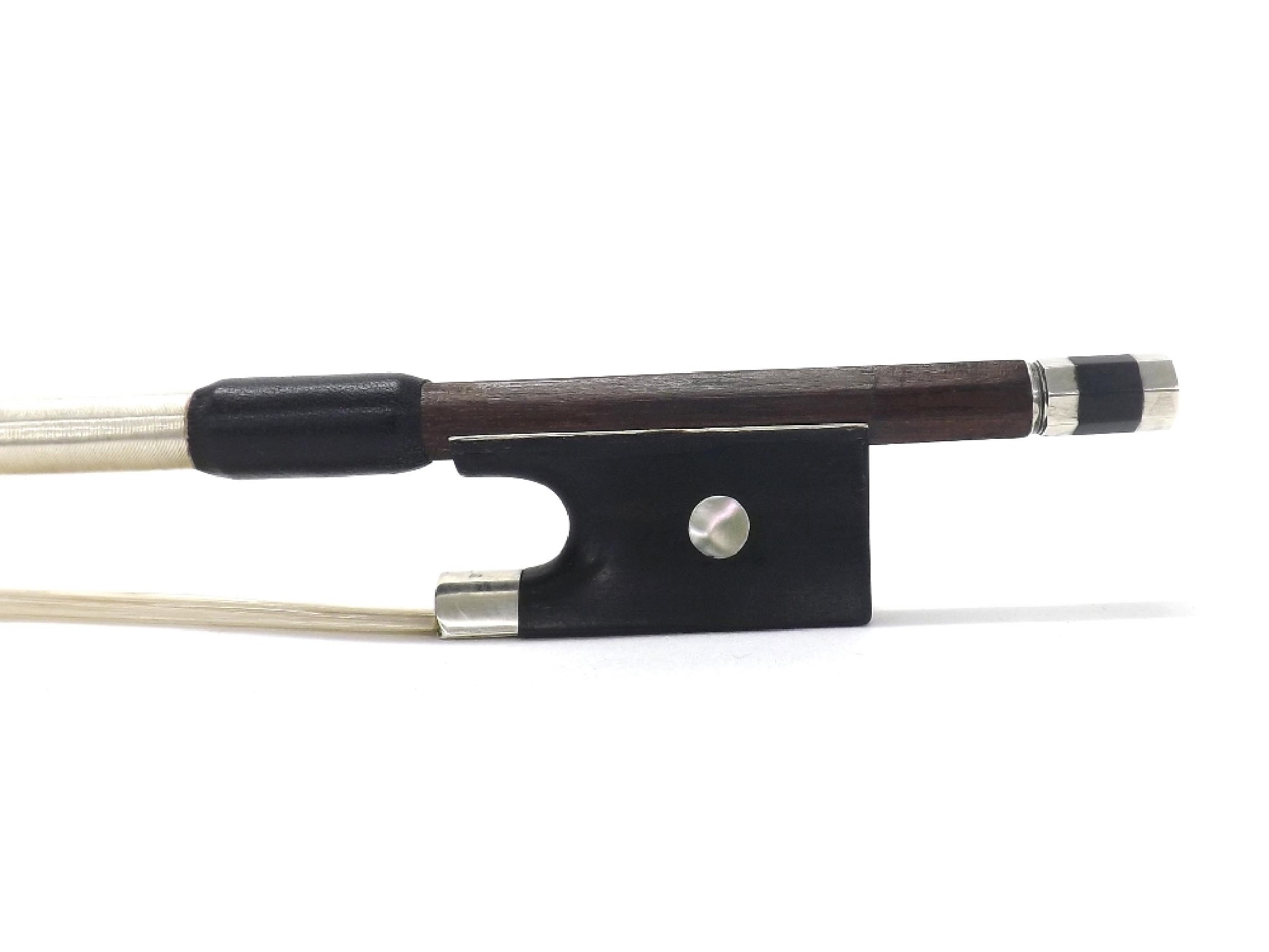 Appraisal: Silver mounted violin bow unstamped the ebony frog inlaid with