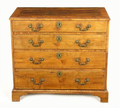 Appraisal: A walnut chest the applied moulded edge top above four