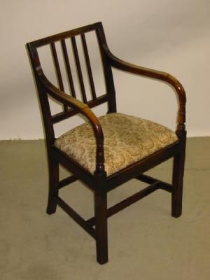 Appraisal: A PAIR OF GEORGE III ELM ELBOW CHAIRS of Sheraton