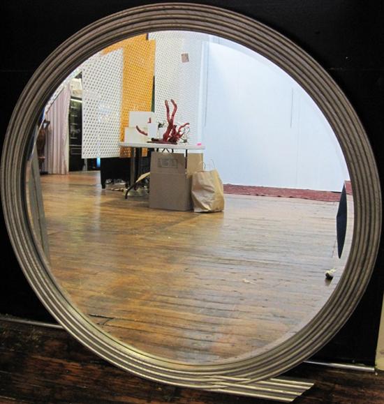 Appraisal: MIRROR A th C modern circular beveled mirror having a