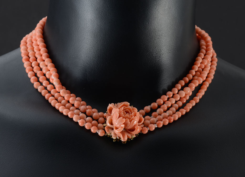 Appraisal: STRAND RED CORAL NECKLACE WITH CARVED CORAL CLASP IN K