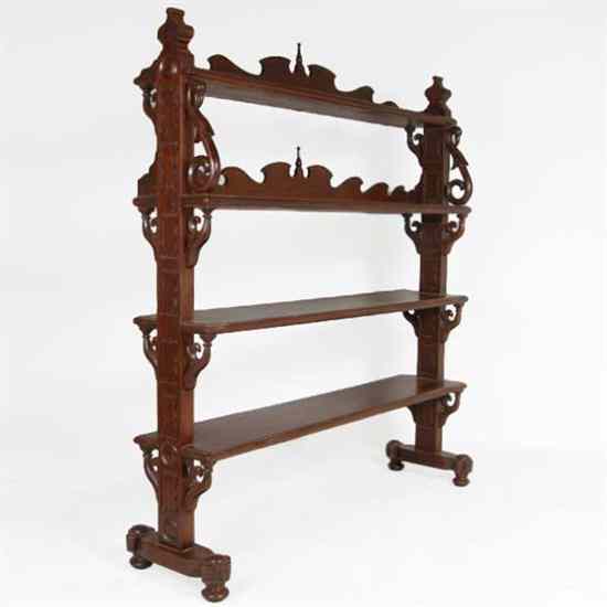 Appraisal: An Anglo Indian Teak Trestle Open Bookshelf circa having carved