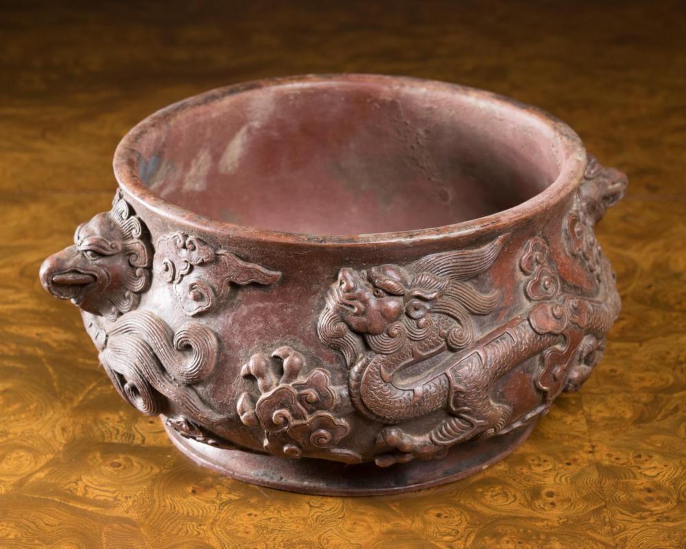 Appraisal: LARGE CHINESE BRONZE DRAGON CENSER circular form of low profile