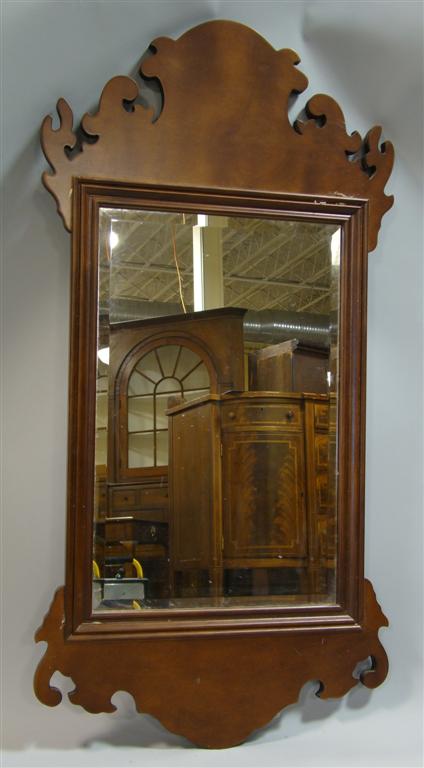 Appraisal: CHIPPENDALE STYLE MAHOGANY MIRROR the shaped and scrolling frame surrounding