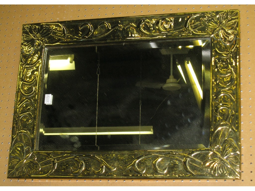 Appraisal: Brass framed mirror with embossed butterfly decoration