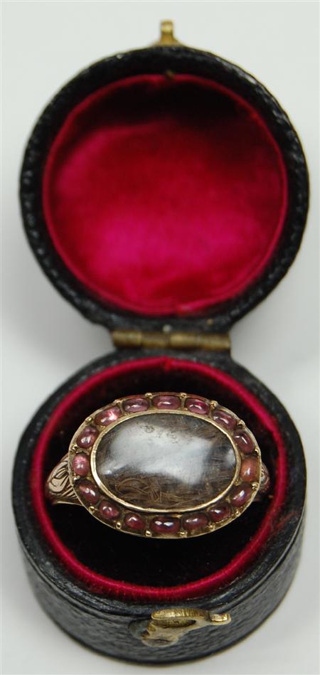 Appraisal: A Georgian memorial ring the oval front with central glazed