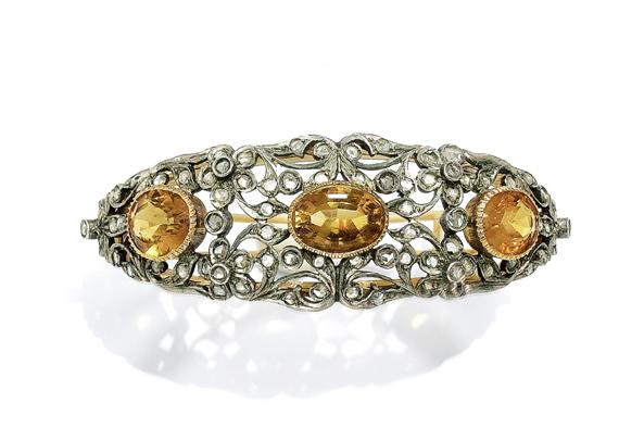 Appraisal: A CITRINE AND DIAMOND BANGLE circa Yellow gold and silver