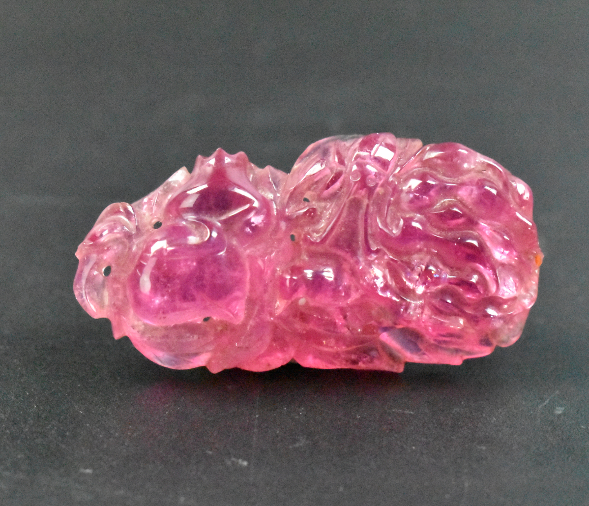 Appraisal: A Chinese tourmaline carved toggle dating from the Qing dynasty