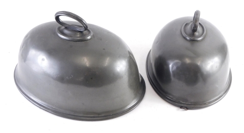 Appraisal: A graduated harlequin pair of pewter meat covers cm wide