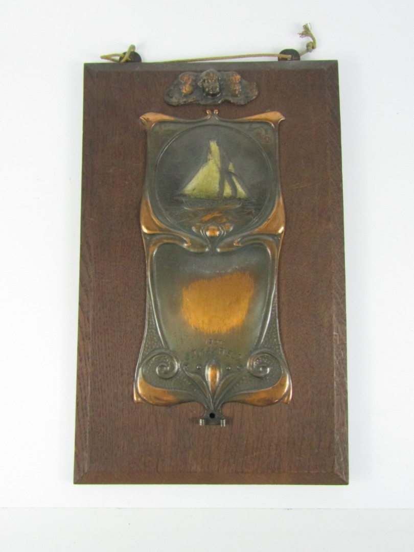 Appraisal: An Art Nouveau copper plaque embossed with a sailing boat