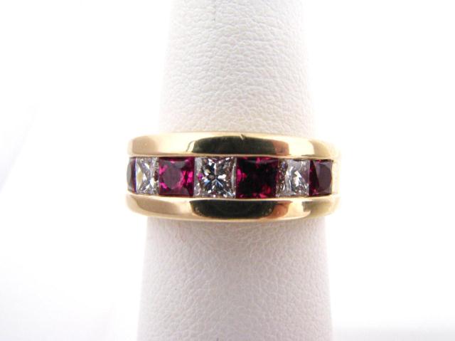 Appraisal: Lady's K yellow gold ruby and diamond band size