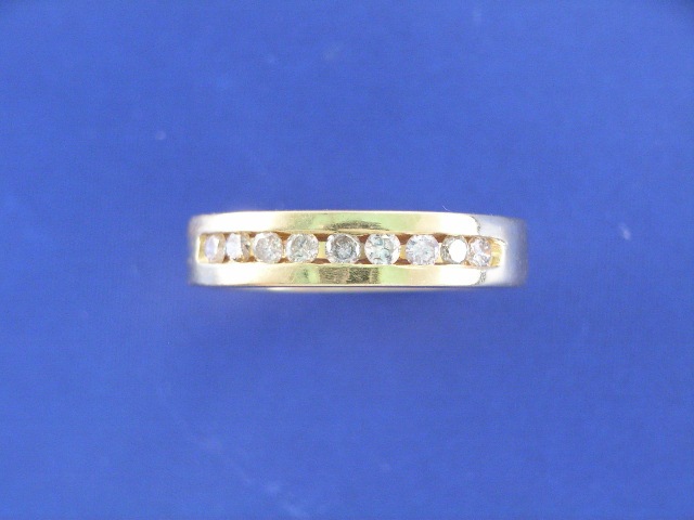 Appraisal: An ct gold nine diamond channel set dress ring ring