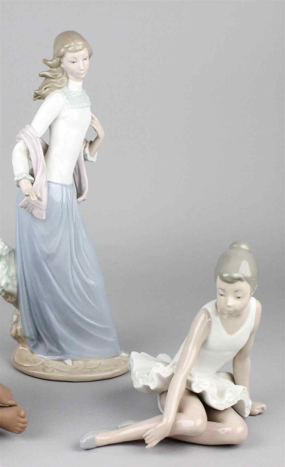 Appraisal: LLADRO FIGURE OF STANDING GIRL together with a seated ballerina