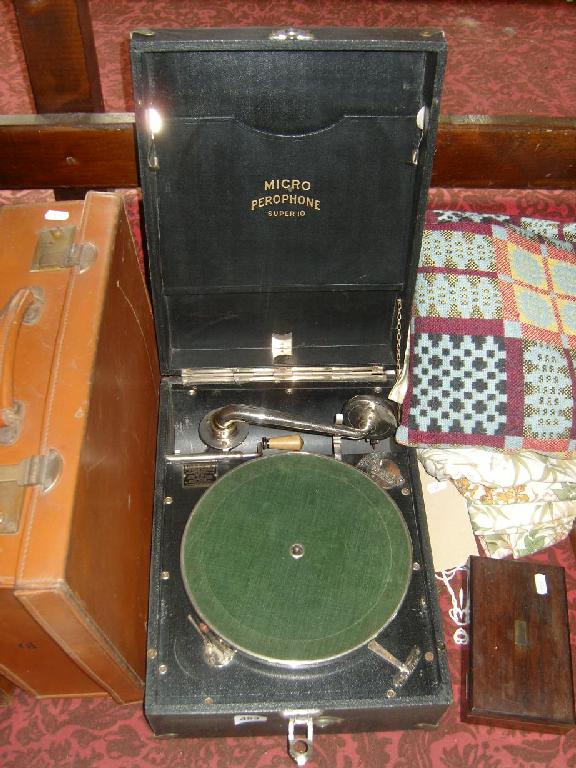 Appraisal: A Micro Perophone super gramophone together with two leather suitcases