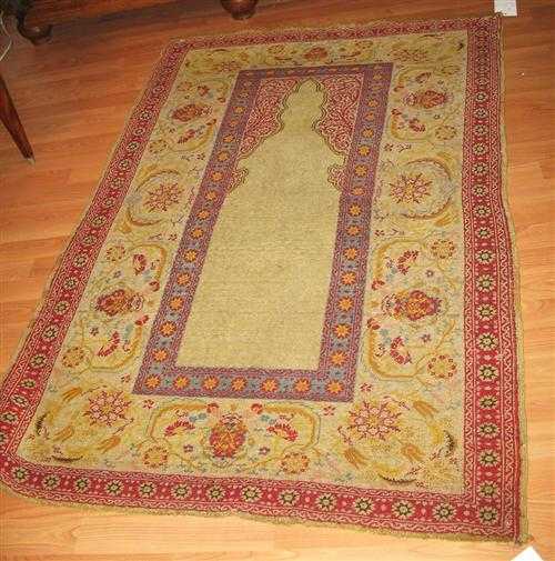 Appraisal: HEREKE PRAYER antique Beige mihrab with red spandrels broad border