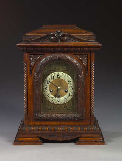 Appraisal: Edwardian Richly Carved Walnut Mantel Clock in the Baroque taste