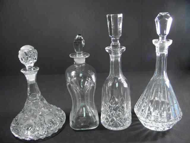 Appraisal: Lot of four assorted crystal and glass decanters Includes a