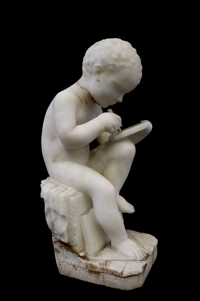 Appraisal: UNSIGNED Marble Sculpture Of A Young Boy Writing Nicely executed