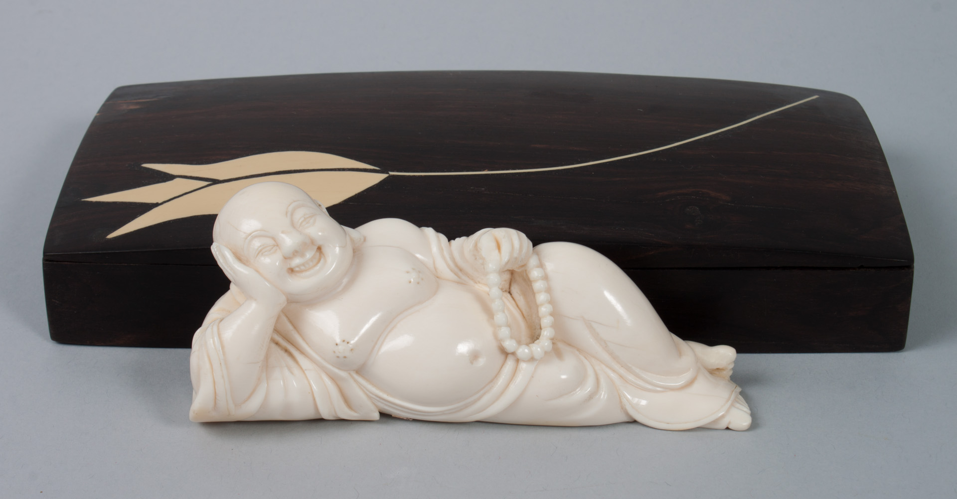 Appraisal: Chinese carved ivory Hotai inlaid scholar's box figure of reclining