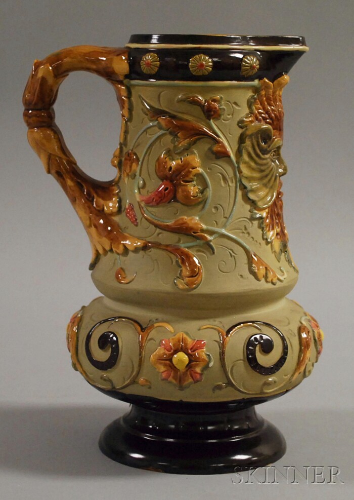 Appraisal: Bohemian Majolica Glazed Ceramic Footed Pitcher with glazed grotesque mask