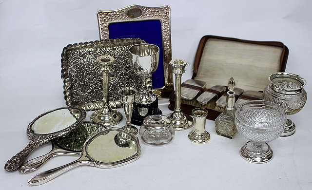 Appraisal: AN ASSORTMENT OF SILVER including two photoframes trays hand held