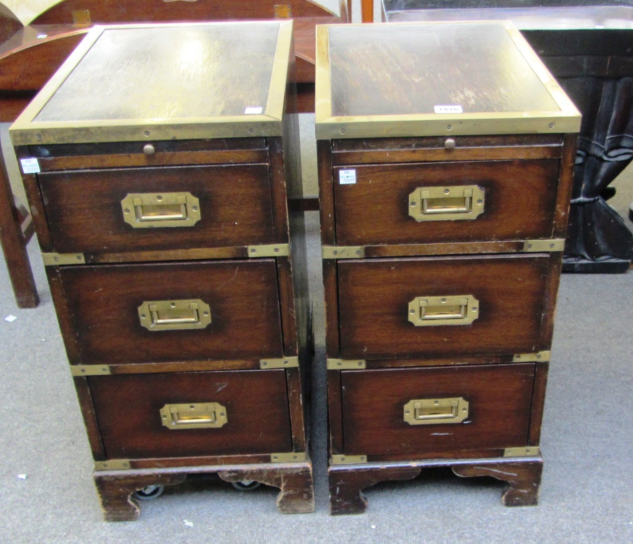 Appraisal: A pair of th century brass bound campaign style pedestals