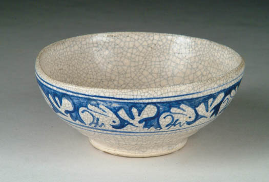 Appraisal: DEDHAM POTTERY FOOTED BOWL WITH RABBIT DECORATION Blue and white