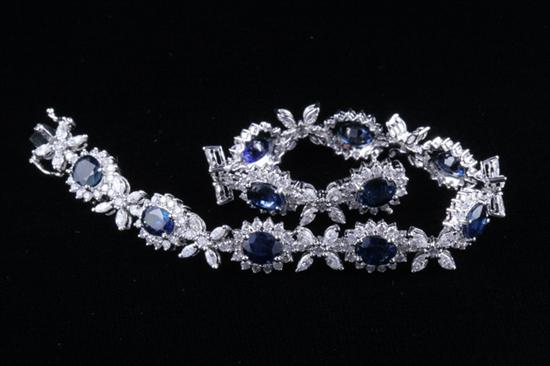 Appraisal: K WHITE GOLD SAPPHIRE AND DIAMOND BRACELET Articulated bracelet set