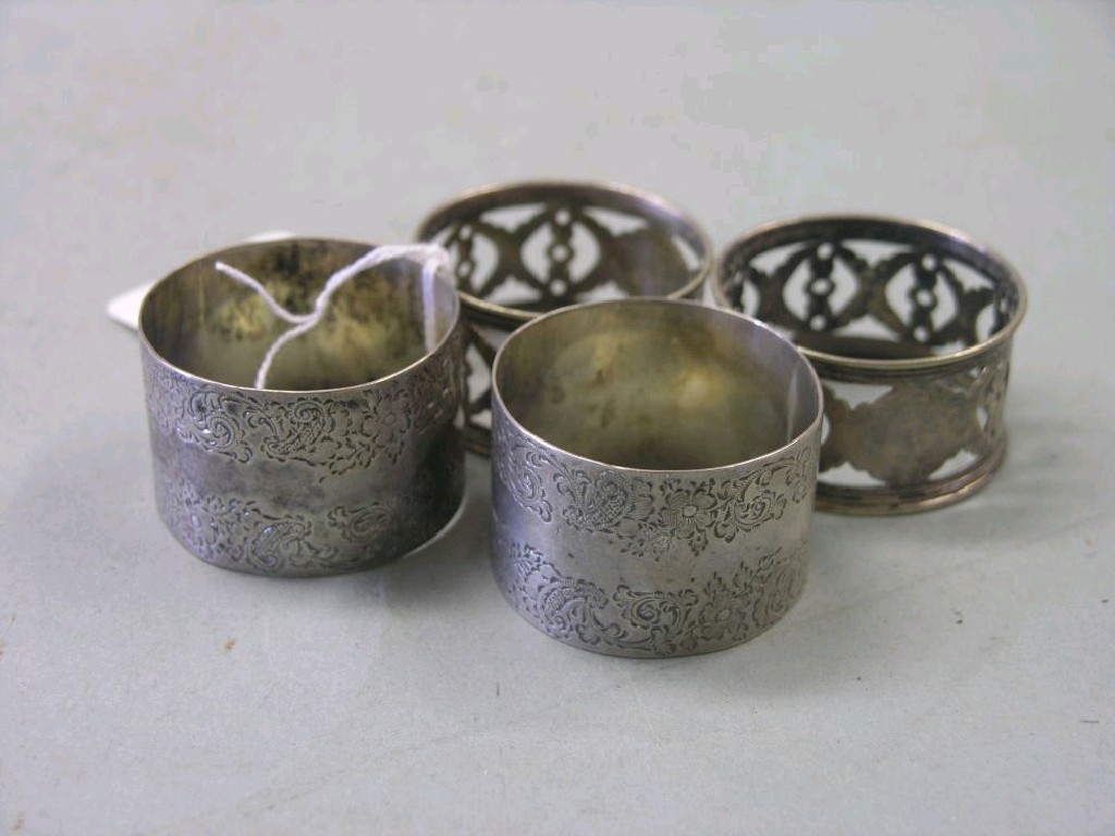 Appraisal: A pair of late Victorian engraved silver napkin rings London