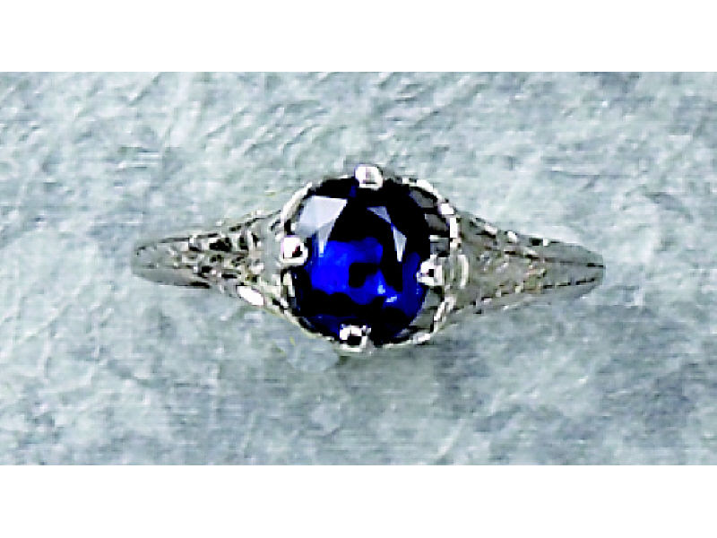 Appraisal: SAPPHIRE RING k white gold engraved solitaire ring set with