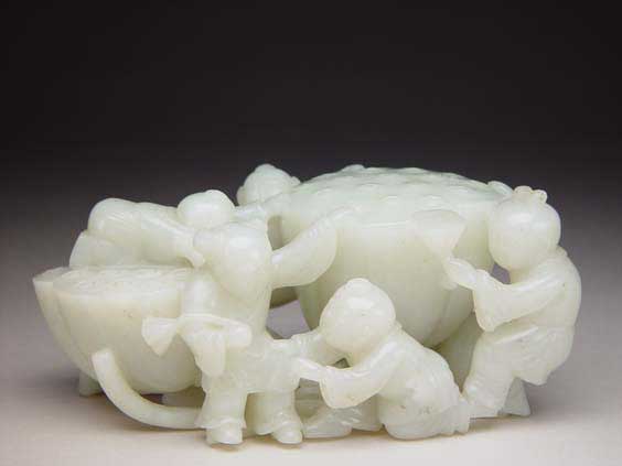 Appraisal: CARVED JADE GROUP BOYS AND LOTUS Well carved and openwork