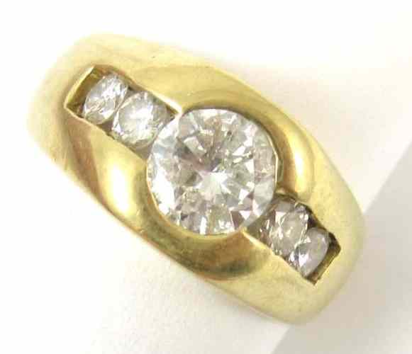 Appraisal: DIAMOND AND TEN KARAT GOLD RING two round-cut diamonds are