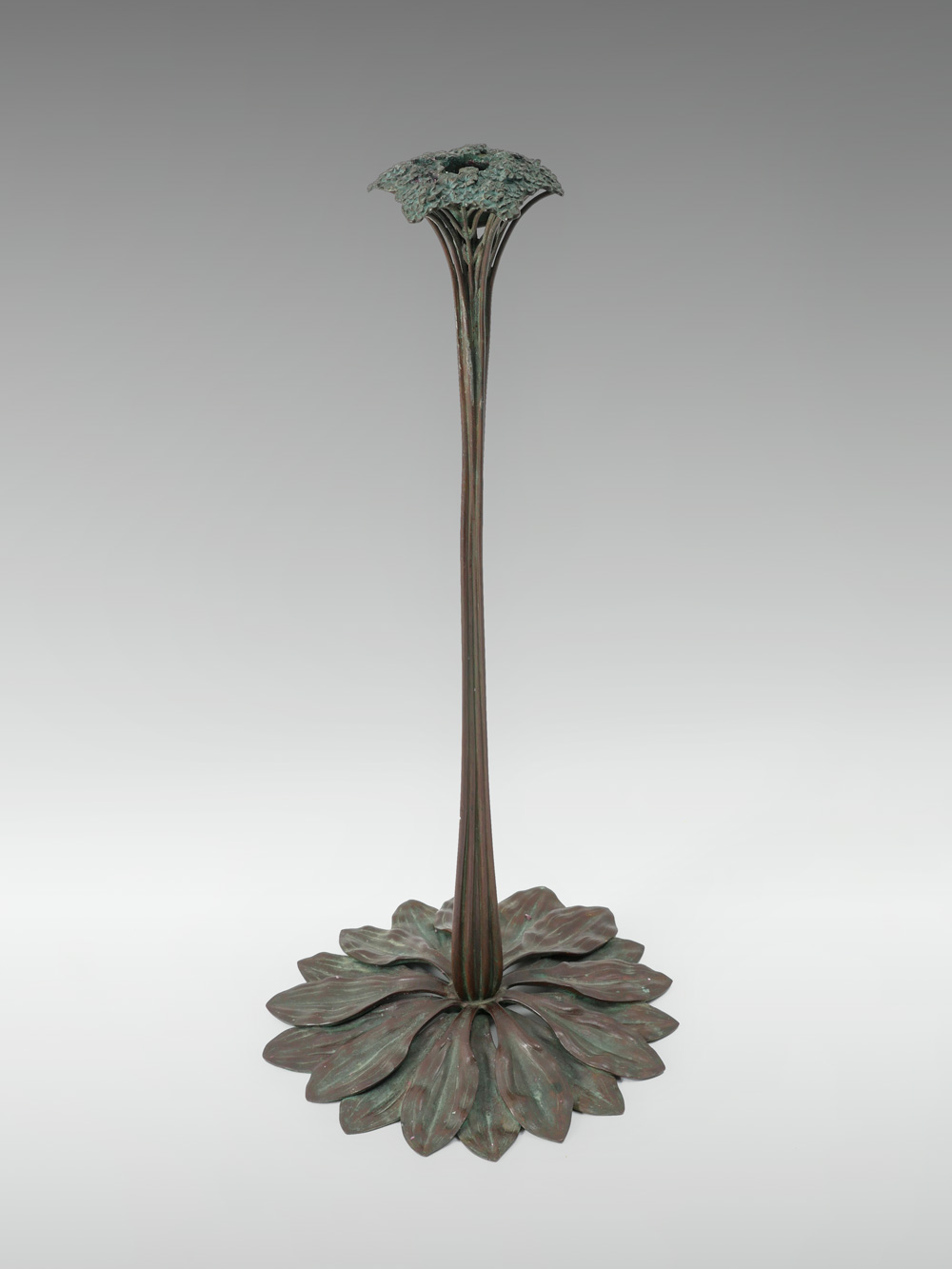 Appraisal: TIFFANY BRONZE SAXIFRAGE CANDLESTICK Early 's Bronze candlestick in the