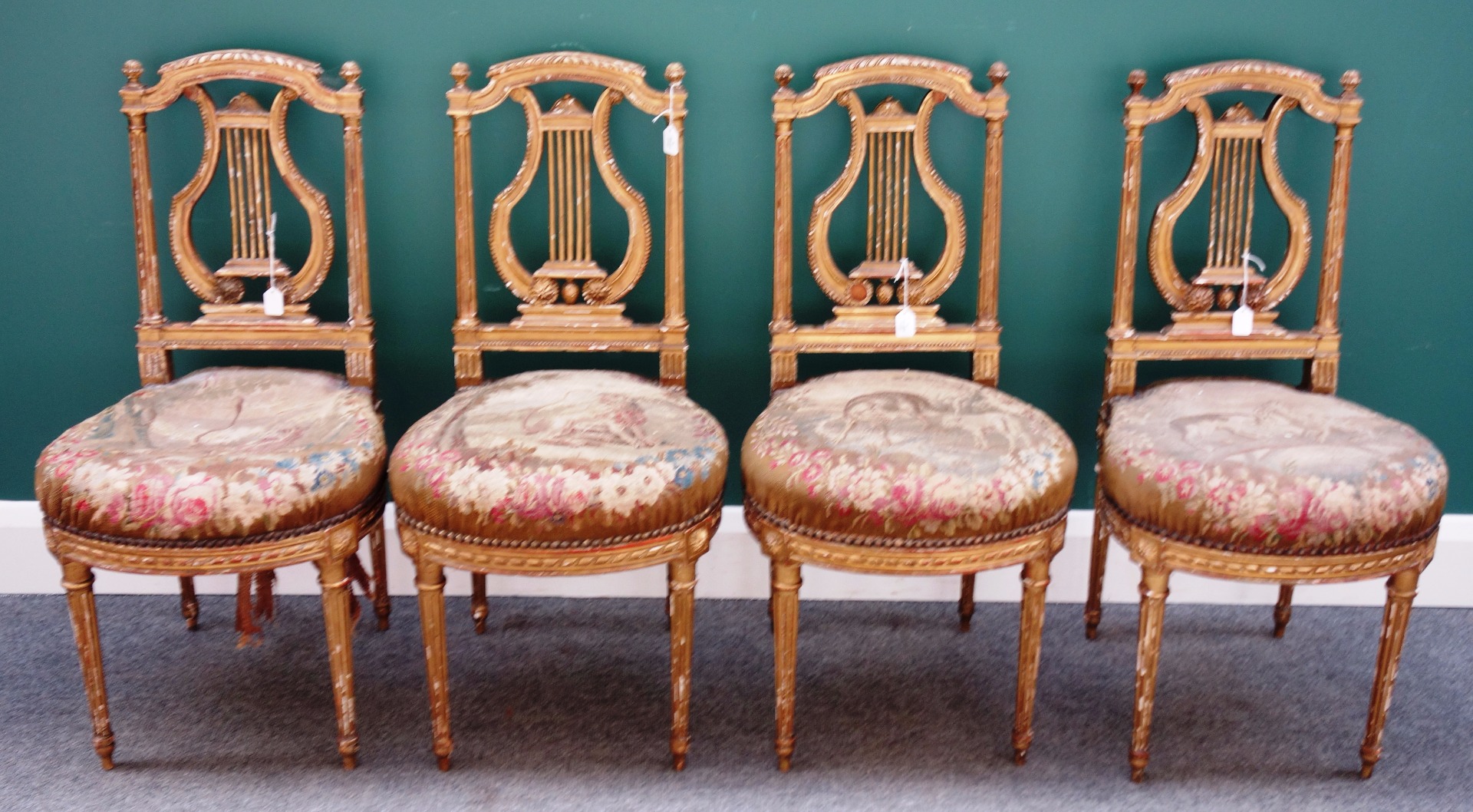 Appraisal: A set of four th century gilt framed side chairs