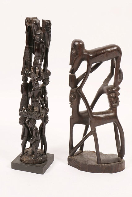 Appraisal: A TANZANIA MAKONDE CARVED GROUP OF INTERTWINED FIGURES on a