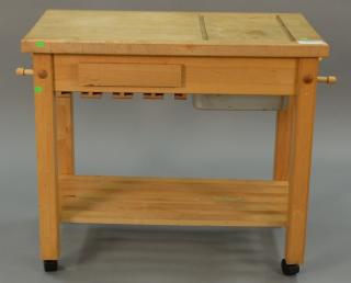 Appraisal: Butcher block serving cart on wheels with sliding top opening