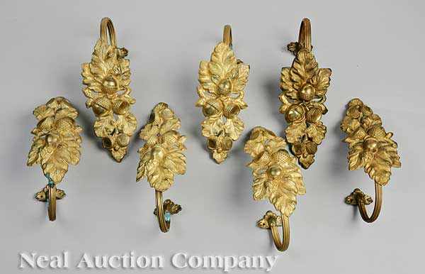 Appraisal: A Set of Eight American Pressed and Gilt Brass Tie