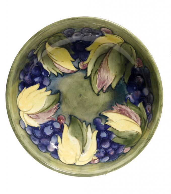 Appraisal: A MOORCROFT GRAPE AND LEAF BOWL DESIGNED BY WILLIAM MOORCROFT