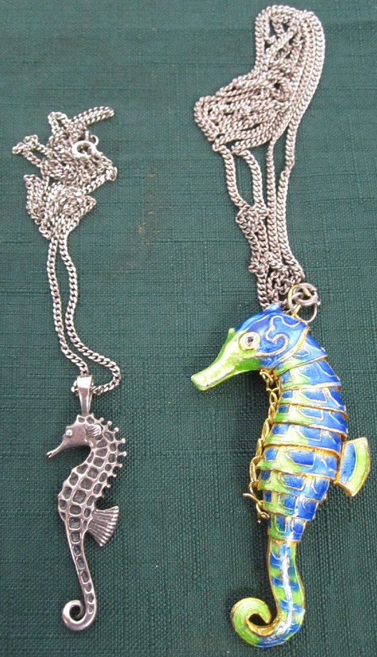 Appraisal: TWO SEAHORSE NECKLACES One enameled one silver with two silver